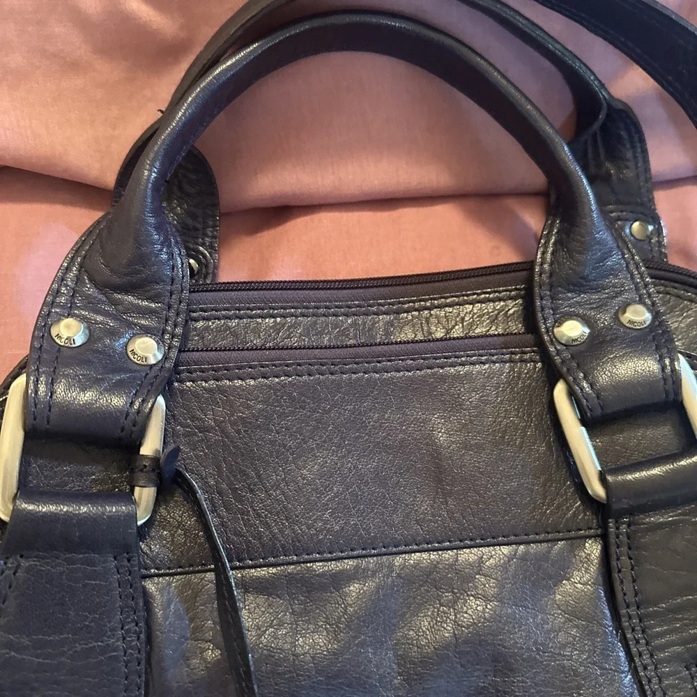 Nicoli Italian leather Large satchel features a dark purplish Blue finish